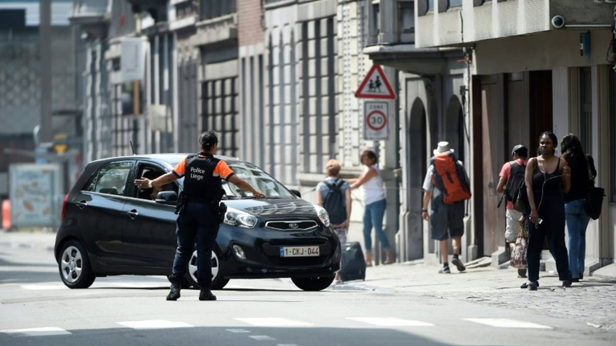 La police sécurisant le quartier de Liège où a eu lieu l'attaque le 29 mai 2018. 
