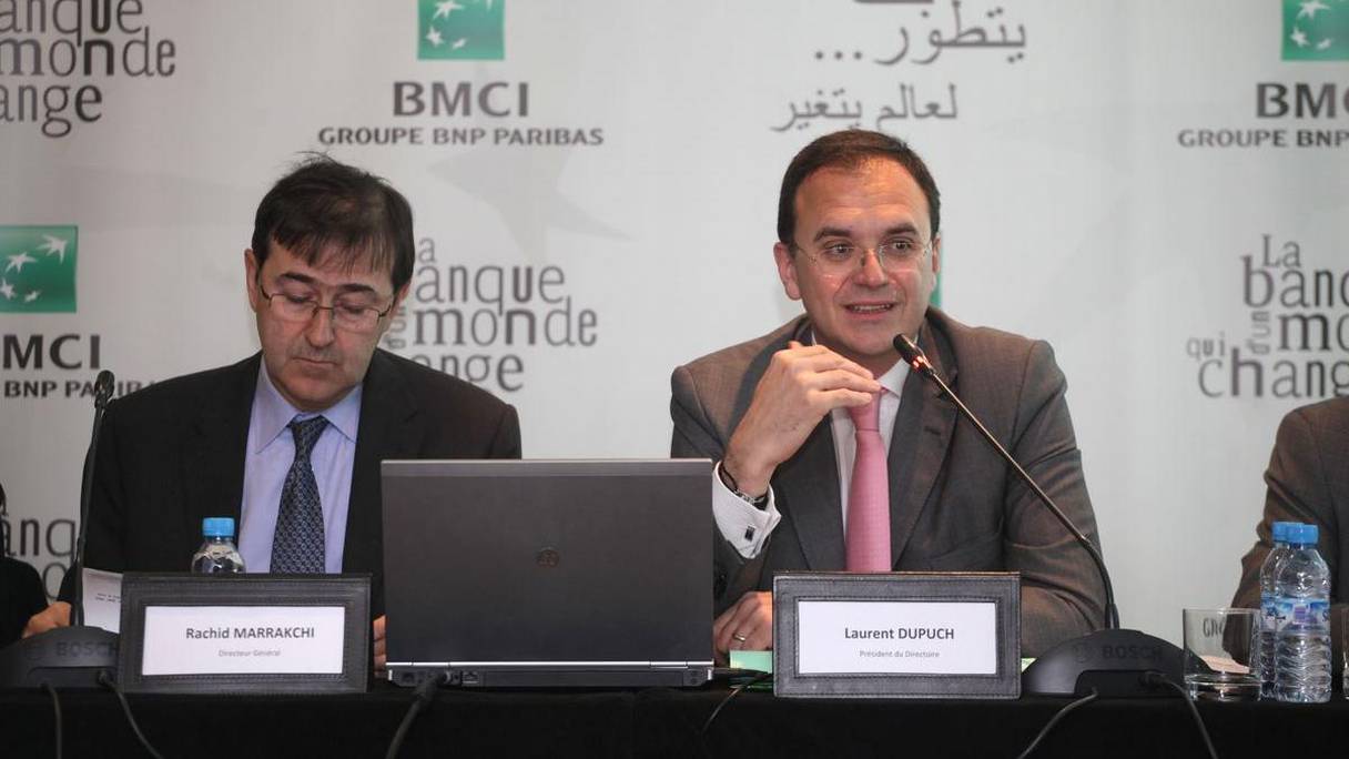 Rachid Marrakchi, DG BMCI, et Laurent DUPUCH, Président du Directoire lors de la présentation des résultats, ce jeudi 19 mars 2015 à Casablanca.
